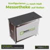 Arbeitsplatte der Messetheke aus HPL-Kompakt 12 mm mit zwei Kabeldurchlässen, darunter der Textilrahmen